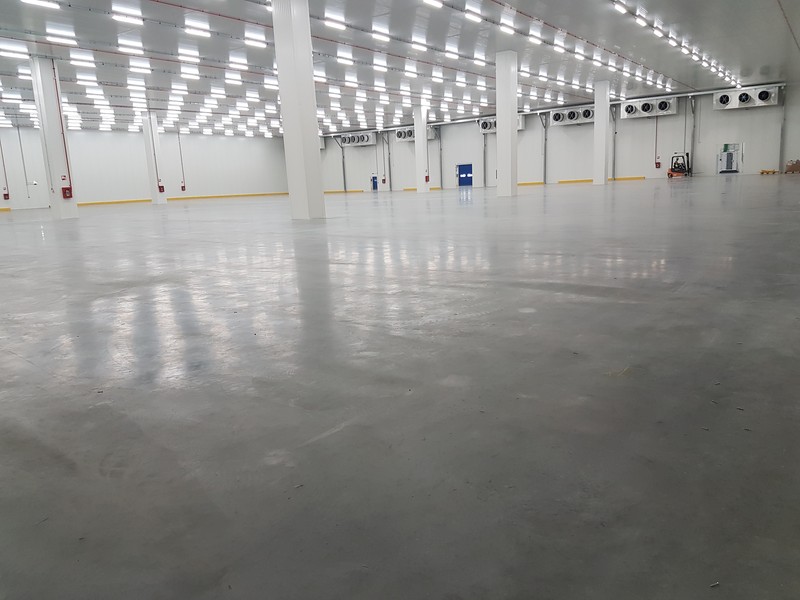 Large empty cold room with industrial unit coolers along the walls